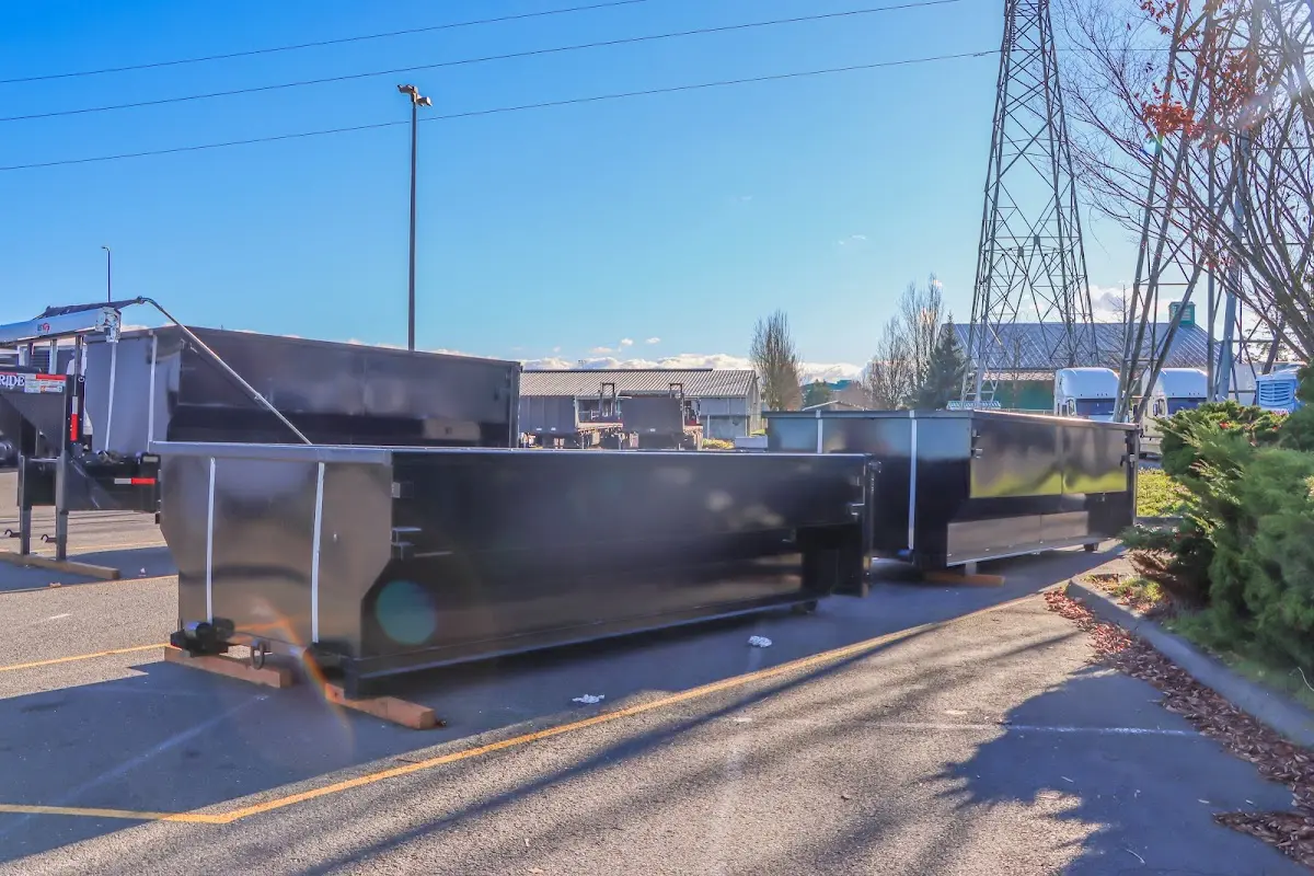 Roll-off dumpster ready for waste disposal at job site for Concrete Dumpster Rental in Bensley